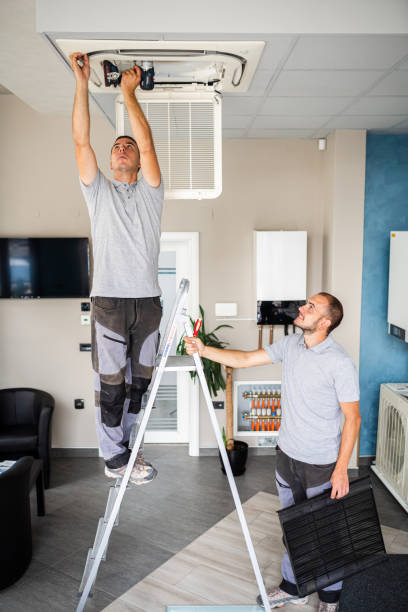 istock Workers checks the air conditioner 1417100277