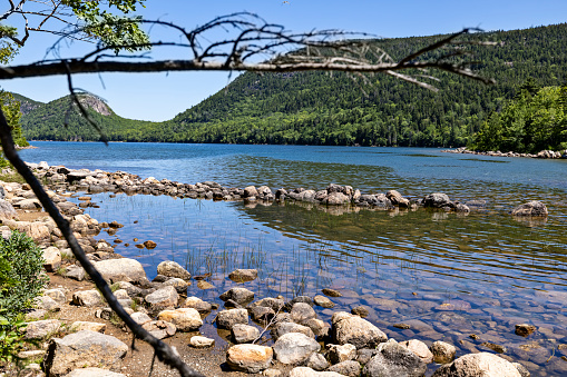Blue sky on a summer afternoon at Jordan Pond at Acadia National Park in Maine.