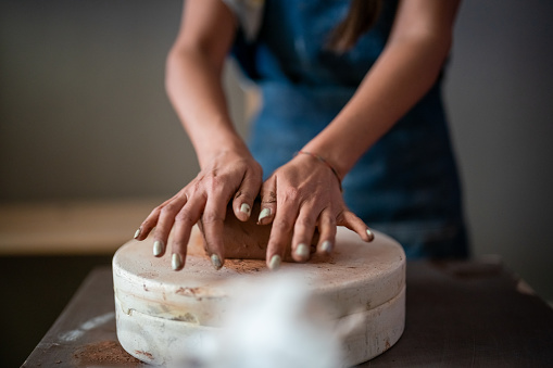 Close up to Kneading ceramic dough