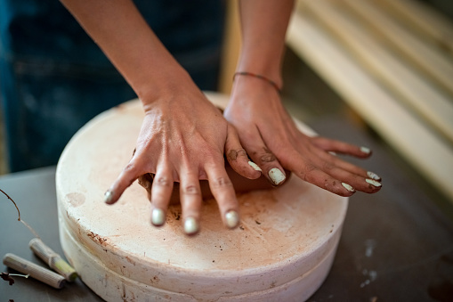 Close up to Kneading ceramic dough