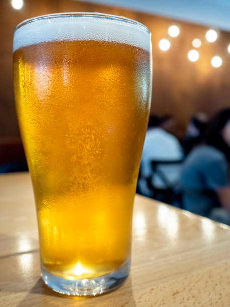 istock Glass of ice cold beer on a bar counter 1417101836