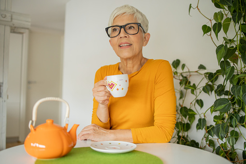 Senior woman enjoying a tea at home