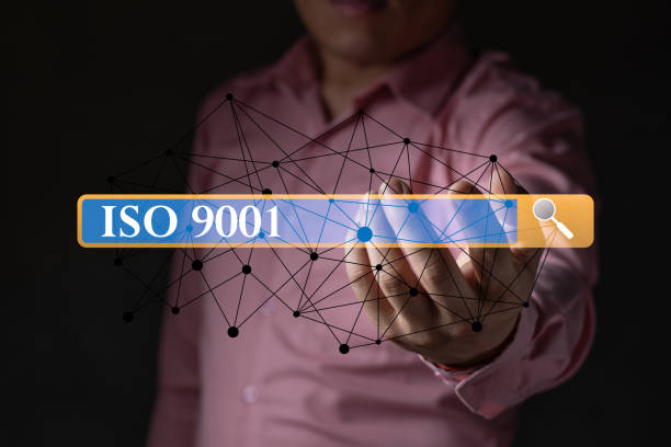 istock A businessman holding the ISO 9001 with search button, connection line standard quality document control for organization and industry management products, copy space for text 1417104131