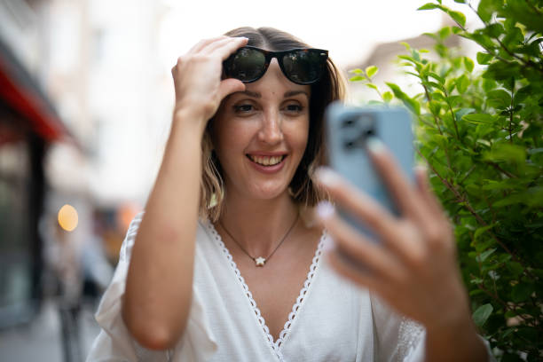 istock Happy Woman using Smartphone 1417107951