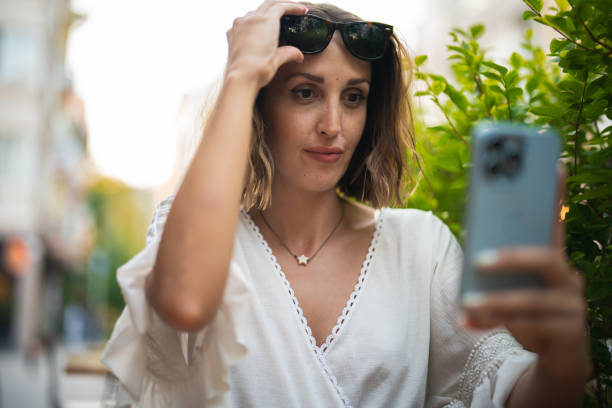 istock Happy Woman using Smartphone 1417107967