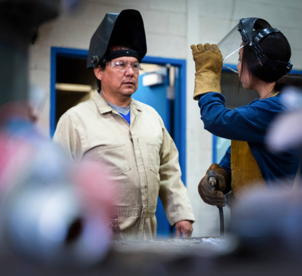 istock Young student learning skills at a metal workshop 1417114305