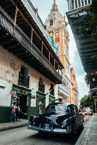 cartagena de indias. 13th august, 2022: a vintage car is parked in cartagena old town