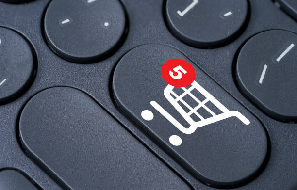 istock Shopping trolley cart and notification on computer keyboard for online shopping and e-commerce business concept. 1417147254