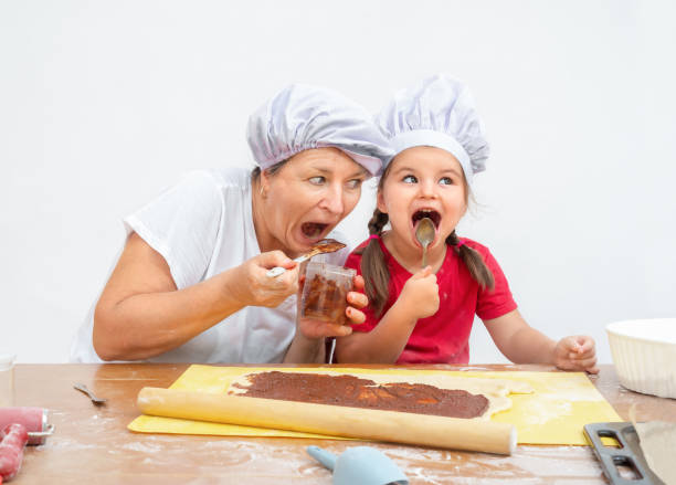 istock senior and child eating 1417170971