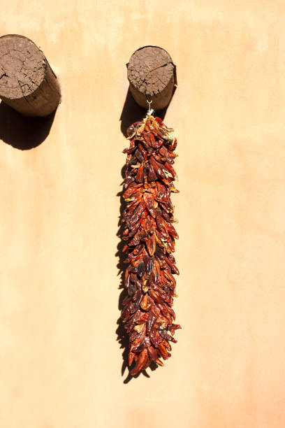 istock New Mexico: Chili Pepper Ristra and Yellow Adobe Wall 1417173268