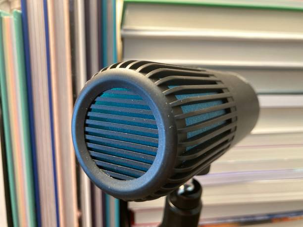 istock A microphone and stacks of colorful books 1417182717