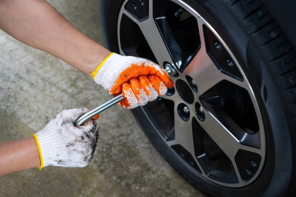 istock Hands wearing cloth gloves for auto mechanics.Hands tools with Auto mechanic concept. 1417182756