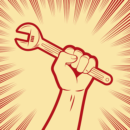A firm fist holding an adjustable wrench in the background with comic effects lines
