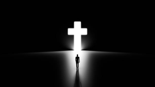 istock 3D Silhouette of a Man Walking into Religious Cross Shaped Hole. 1417189039