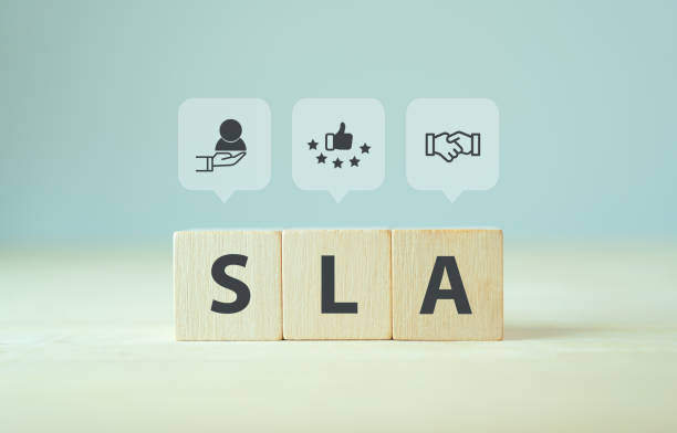 istock SLA - Service Level Agreement acronym, business concept. Service performance tracking to reduce the uncertainty the customer in process. Wooden cubes with Service Level Agreement icon and abbreviation 1417195539