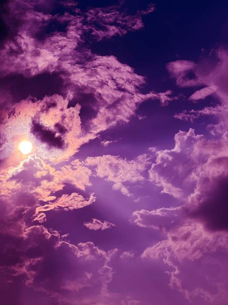 Purple sky clouds at mysterious night on Halloween.