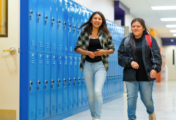 istock Best friends walking on a corridor at school 1417198262