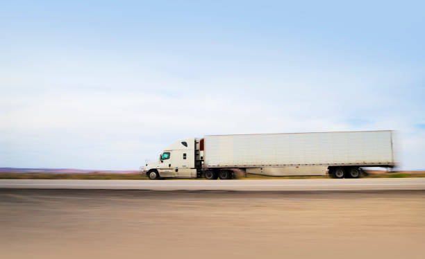 istock White semi-truck transporting goods 1417198316