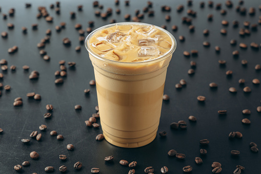 Iced Latte Coffee on Black Background with Coffee Beans
