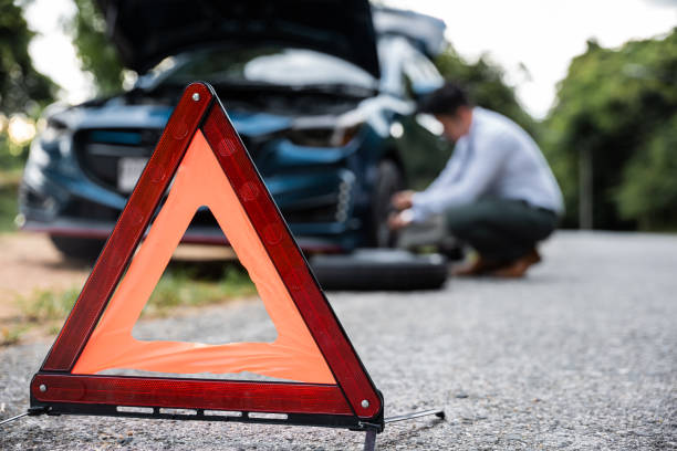 istock Asian businessman car broken has problems with wheel of his car 1417207445