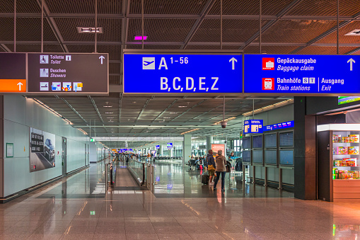 Frankfurt; Germany - October 16, 2018: Frankfurt; Austria - October 16, 2018: Long corridor with a Moving walkway at an airport