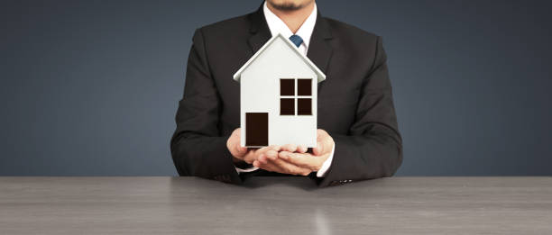 istock House Residential Structure in  hand 1417210190