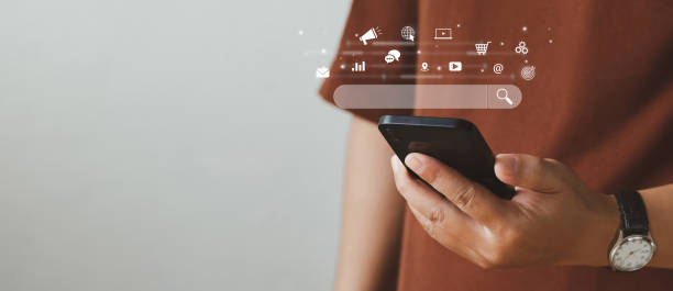 istock SEO Concept. Men use smartphones with laptops. SEO icon for analysis SEO Search Engine optimization your website to rank in search engines or SEO. best promoting ranking traffic on your website. 1417210310