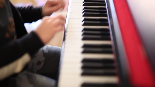 Teenage Boy Plays the Piano