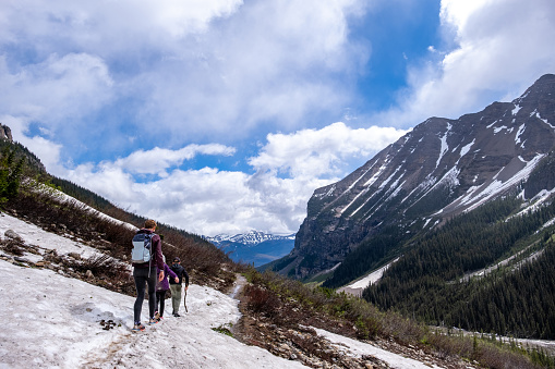 Family hiking on a glacier in the Banff National Park. Things to do in the National Parks of British Columbia. Hiking trails around Lake Louis