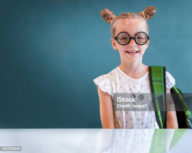 Little Smiling Funny Nerd Girl Stock Photo - Download Image Now - Back to School, Blond Hair, Blue