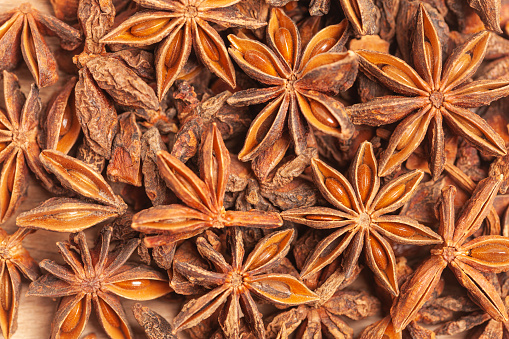A group of star anises isolated on white background. Dried star anise spice fruits top view