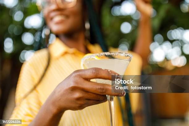 Close Up Shot Of Cheerful Young Woman Enjoying A Margarita Cocktail Stock Photo - Download Image Now