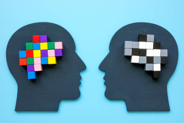 istock Positive and negative thinking concept. Heads and brain from colored cubes. 1417228031