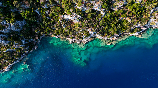 Aerial view of Sunken city in Kekova, Antalya. 

After the Italian occupation of Kastelorizo, Kekova — which at that time was temporarily inhabited during summer because of wood harvest — was disputed between Italy and Turkey. The 1932 Convention between Italy and Turkey assigned it to Turkey.

On its northern side there are the partly sunken ruins of Dolchiste/Dolikisthe, an ancient town which was destroyed by an earthquake during the 2nd century. Rebuilt and still flourishing during the Byzantine Empire period, it was finally abandoned because of Arab incursions. Tersane (meaning 