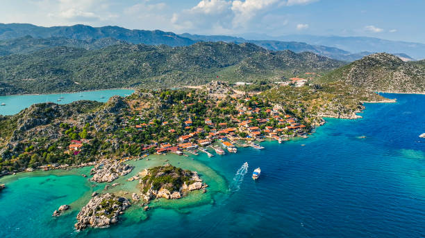 drone view of kaleköy, aerial view of ucagiz, rock tomb in kekova, antalya, townscape of kalekoy-simena, aerial view of simena castle, popular holiday destination, aerial view of sunken city - província de antália imagens e fotografias de stock