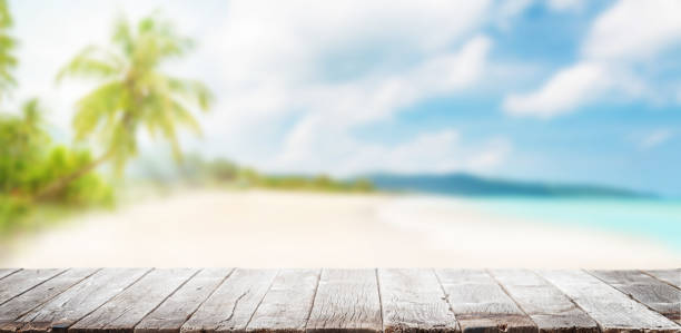 istock Empty wooden table or pier with sunny beach and sea 1417255734