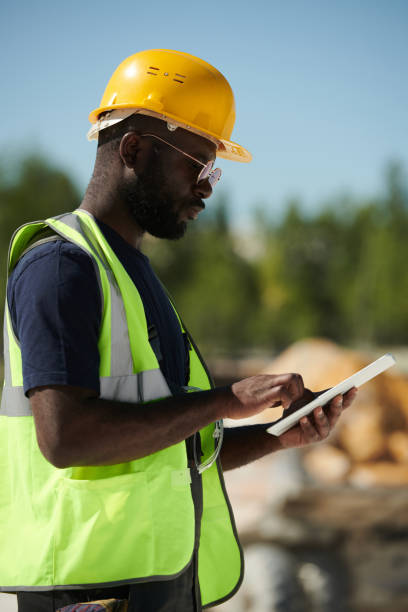 istock Young serious African American engineer scrolling through online manual guide 1417260530