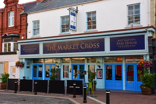 Holywell, Flintshire, UK: Aug 14, 2022: J D Wetherspoon operate a free house pub, The Market Cross, in Holywell