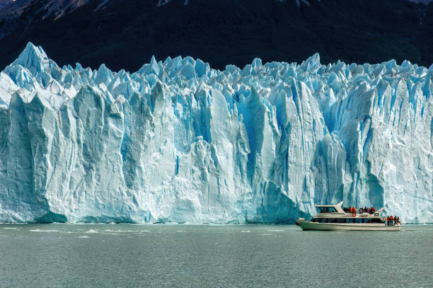 Cruise boat in front of Perito Moreno Glacier in Patagonia, Argentina. stock photo