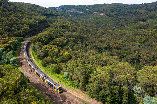Sydney Passenger train Travelling north coming out of a tunnel, from Sydney NSW, towards the Central coast.