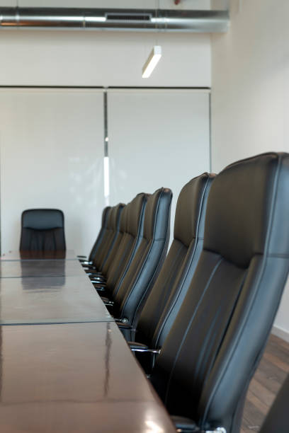 istock Meeting room with a big polished table and executive arm-chairs. 1417278068