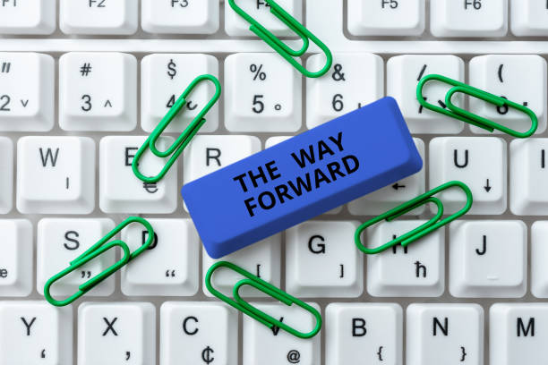 istock Hand writing sign The Way Forward. Concept meaning Direction to keep going with success Motion strategy 1417278954