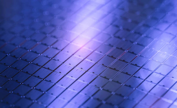 silicon wafer reflecting different colors. silicon wafer reflecting different colors. computer wafer stock pictures, royalty-free photos & images