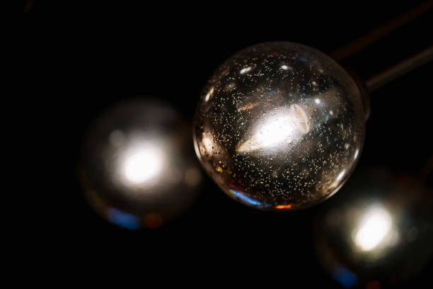 istock modern light bulbs made of transparent clear glass. sphere lamp hanging on decorative ceiling on dark background 1417283863