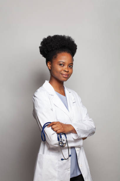 istock Smiling medical physician doctor posing on grey background 1417289090