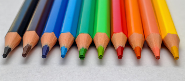 Many colored pencils isolated on a white background