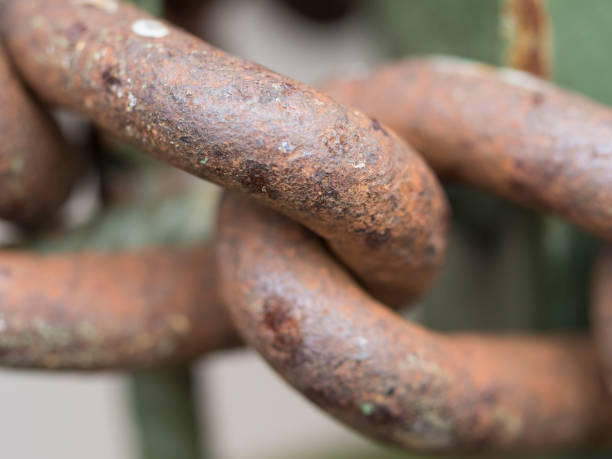 istock Macro of old rusty thick iron chain link, selective focus. connection or joinning concept 1417294613
