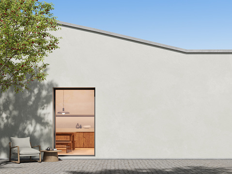 3d render of modern house with large concrete wall and window, Backyard with cobble stone terrace floor.