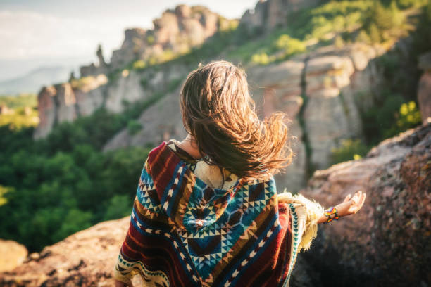 Embrace the moment! Young boho woman in the nature. Girl hiking in red rock formations. Shaman woman with arms outstretched. sedona stock pictures, royalty-free photos & images