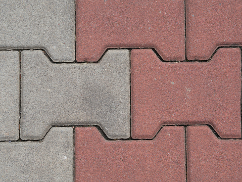 close up red and white interlocking pavement background